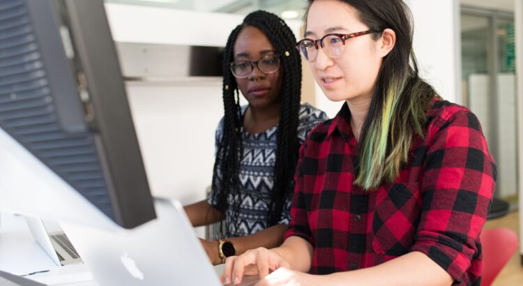 two people looking at a screen together